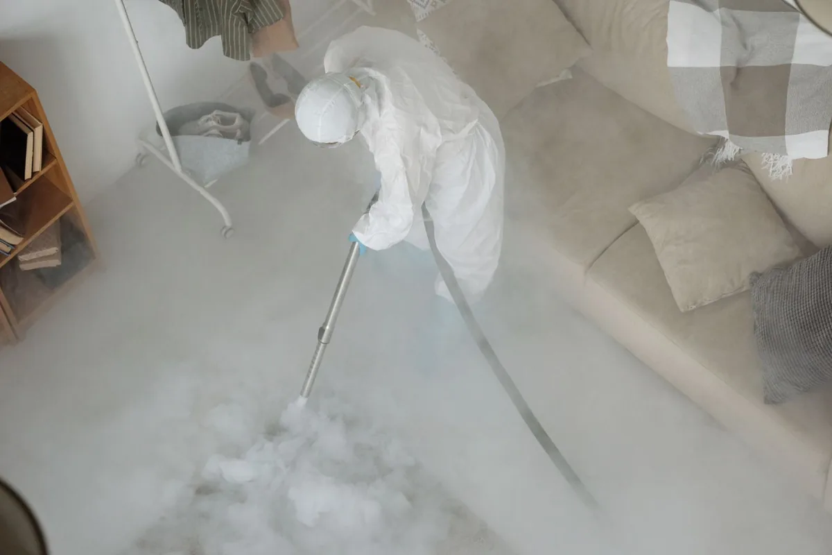 Biohazard cleanup technician in protective equipment, Bemiss, GA